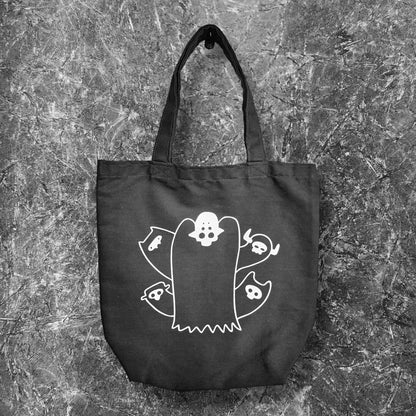 our accent tote bag featuring our original character Papa Grim.