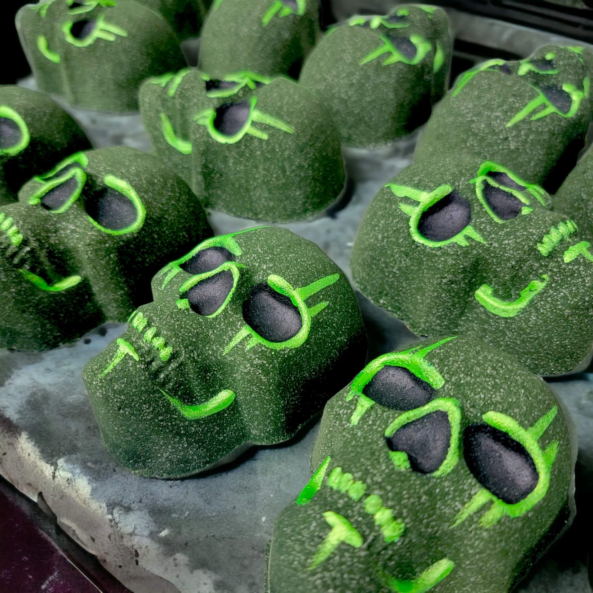 Group picture of our skull bath bombs in the scent Toxic.