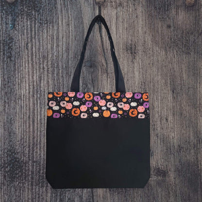 our accent tote bag featuring our Purplexing Pumkins pattern.