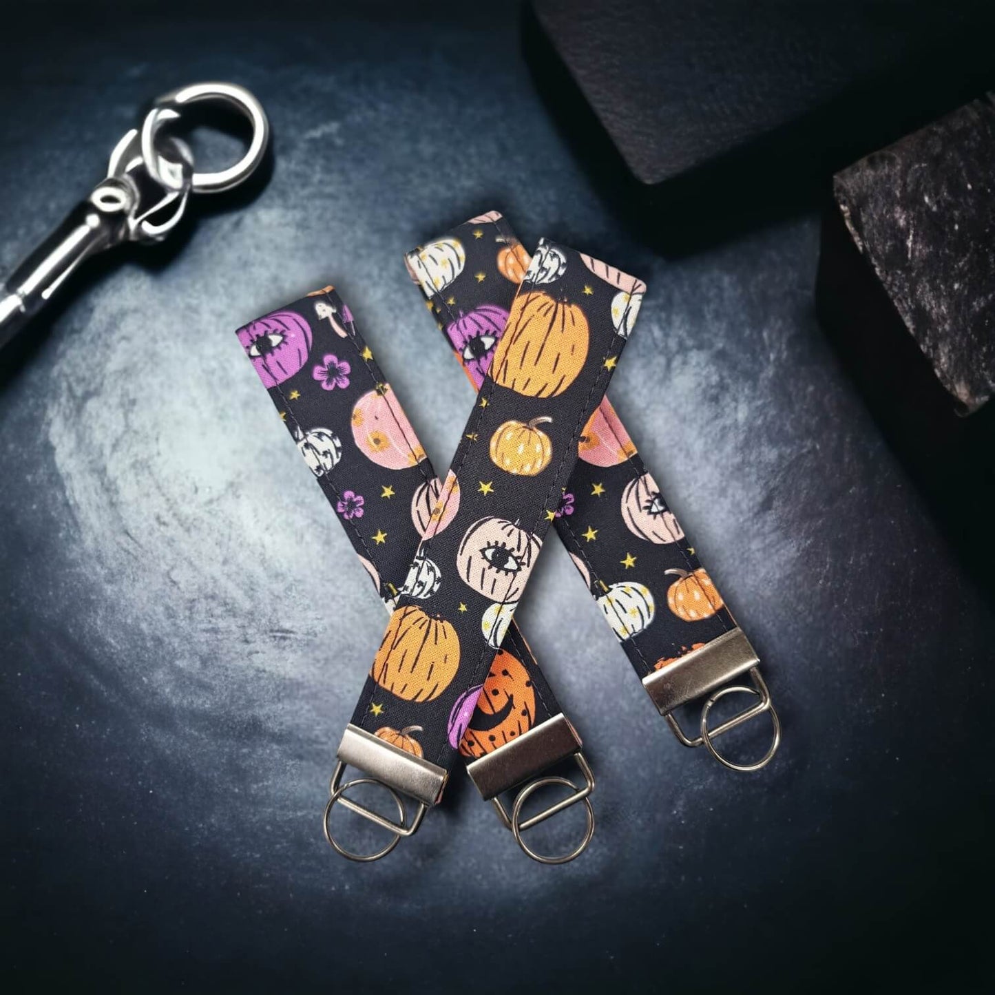 Our key wristlets/fobs in the pattern Purplexing Pumpkins.